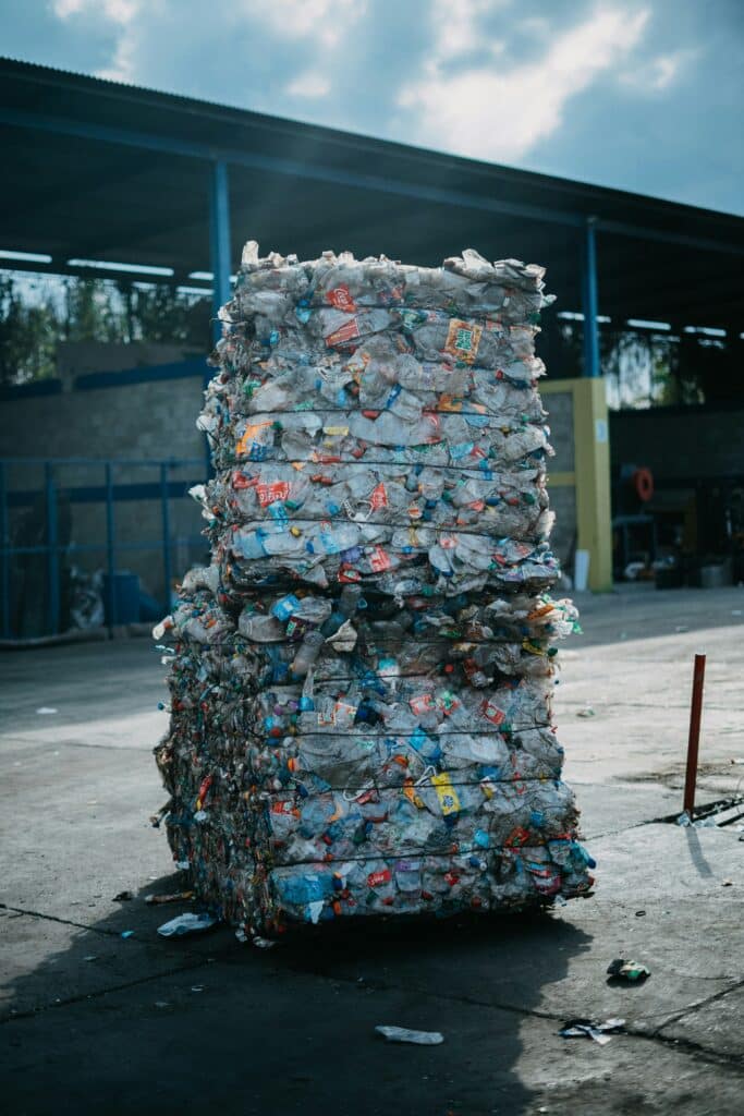 Two piles of waste ready to be processed at a recycling plant